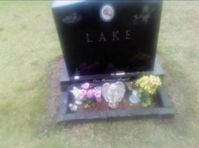 Maintenance workers have reduced the size of the border at the gravesite to comply with regulations. Initially, the fake flowers were also removed but were put back after Young pointed out that they didn’t violate any guidelines. Photo courtesy: Kimberly Young