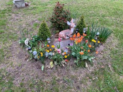 Michelle Smith said that when her daughter, Shannon Smith, died unexpectedly, her family did not have enough money to buy a standing headstone. She has carefully maintained the small garden around the stone for years. Under the new rules, she would not be able to leave any flowers at the grave. Photo courtesy: Phillip Vary