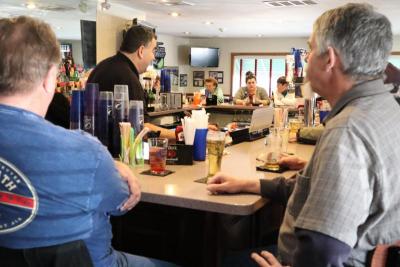 The bar at Vel’s Restaurant was packed on Monday, but it will be shut down on Tuesday, March 17 due to mandatory restrictions.