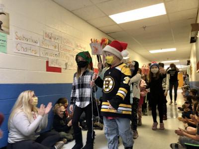 Students from Kristin Matathia’s class embraced crazy hat day during the parade. Shelby Glover donned an elf hat and Gunnar Norcross wore a santa hat.