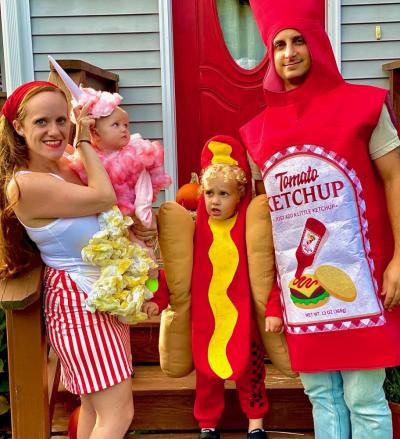 Kathryn Latham said a friend made this carnival food-themed family costume using materials from Dollar Tree. Kathryn was popcorn; five-month-old Abby was cotton candy; Charlie, 3, was a hotdog; and Anthony was ketchup. Photo courtesy: Kathryn Latham