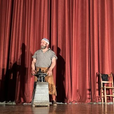 Hammer time: Blacksmith Nathan Bassett, portrayed by Dean Rantz of Rock Village Forge, poses in front of his anvil.