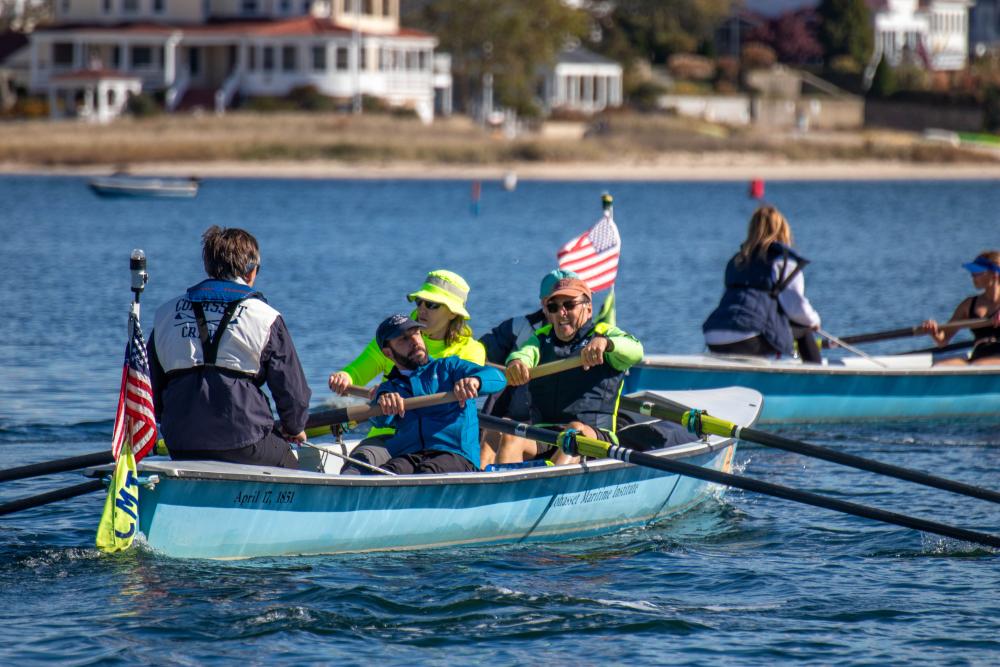 Doug Mclellen, John De Beaollo, Cassie Havey,  Bruce Gehrlein and Eric Ratchote row toward Wickets Island. none