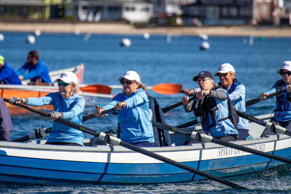 Dharma Voyage rowers get the race started in the "Spirit of Westport." none