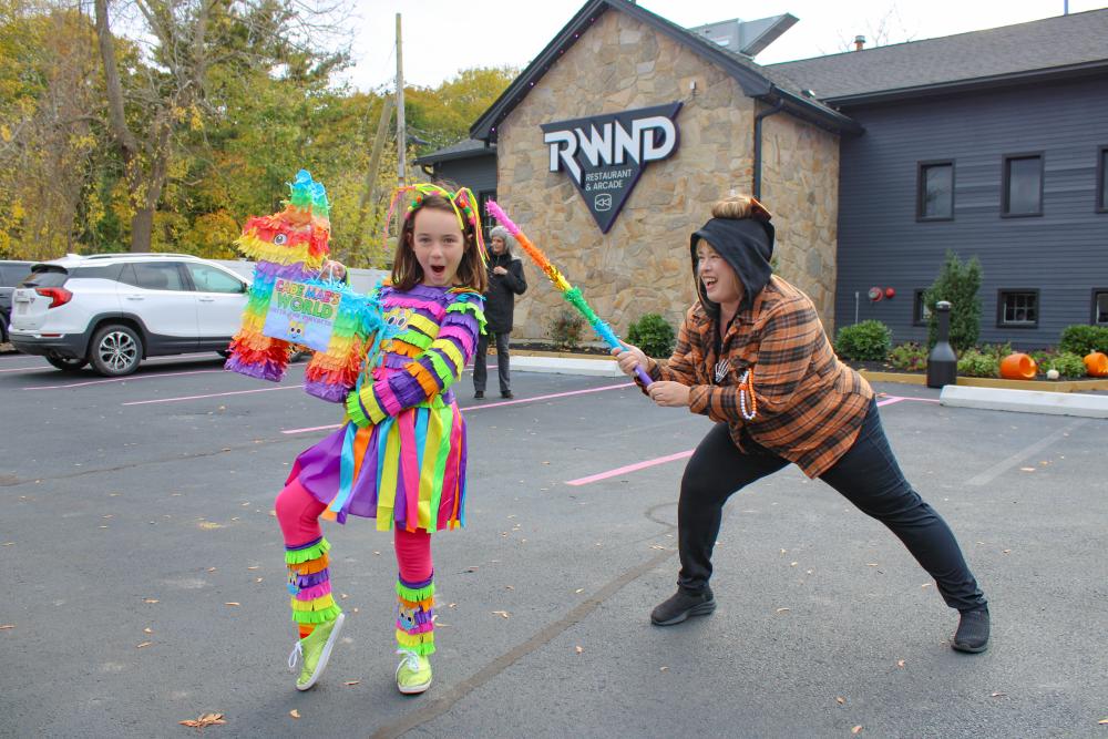 Cade Mae Pearson's costume is a smash hit as her mom tries to get some candy. Photos by Brandy Muz Cade Mae Pearson's costume is a smash hit as her mom tries to get some candy.