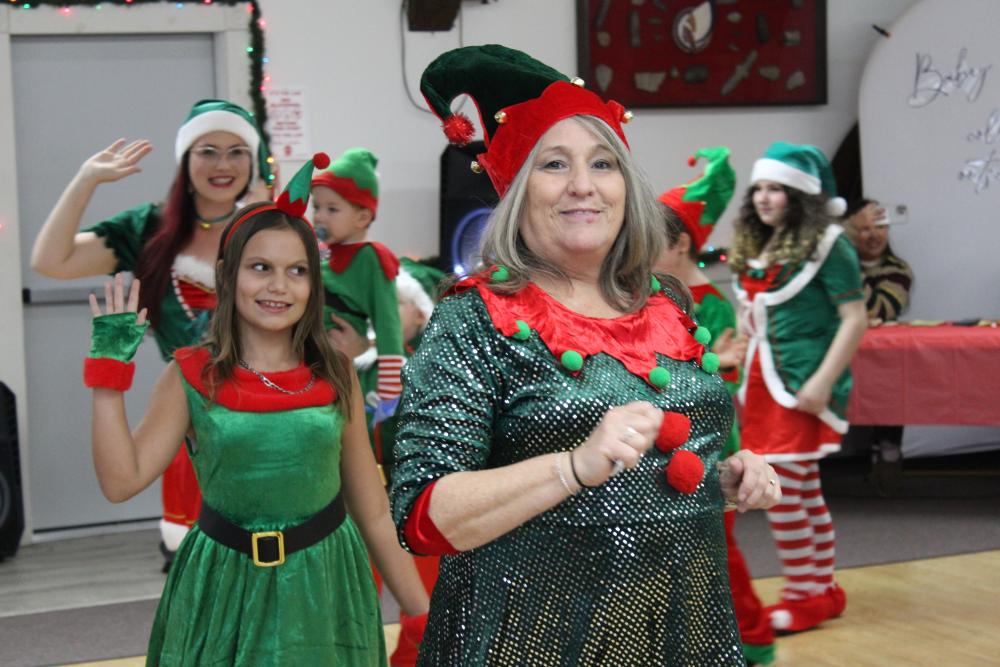 Elizabeth Wingert leads the elf parade. Photos by Brandy Muz