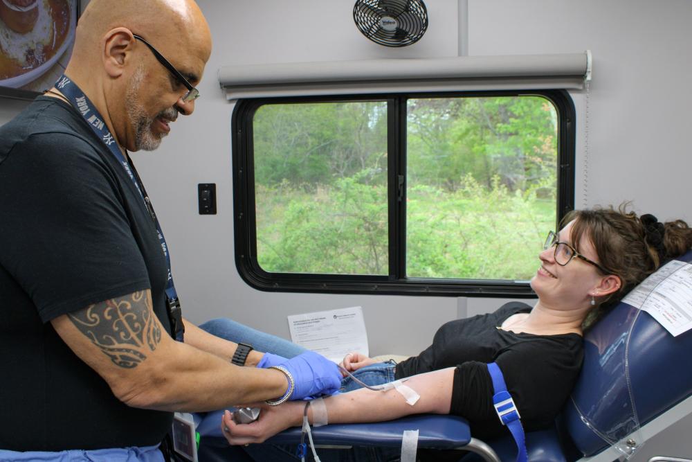 Phlebotomist Angel Martinez, left, begins drawing Arisa Whynot's blood during the Wareham Police Department's blood drive on Saturday, May 9. Photos by Grace Roche