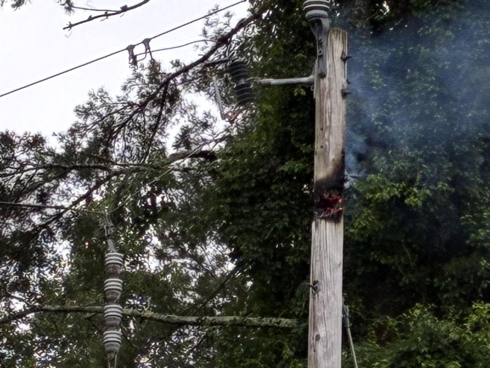 A hole burned into a utility pole on Cromesett Road on Monday, July 6, knocking out power to residents. Source: Laura Taylor
