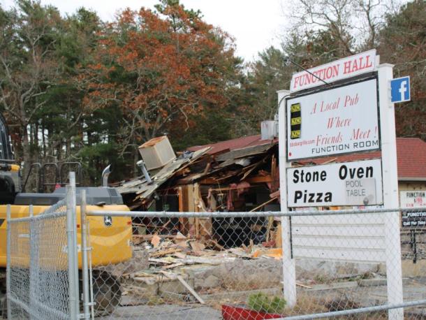 The sign for BB's Bar and Grille still stands during demolition. Photos by Brandy Muz