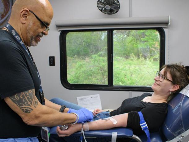 Phlebotomist Angel Martinez, left, begins drawing Arisa Whynot's blood during the Wareham Police Department's blood drive on Saturday, May 9. Photos by Grace Roche