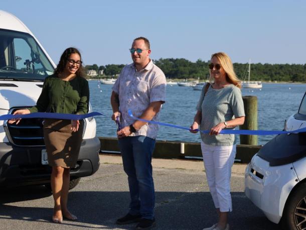 From left to right: Thandi Nyambose, John Faherty and Sarah Corbitt cut the ribbon on the Circuit shuttle. Photos by Nick Mossman
