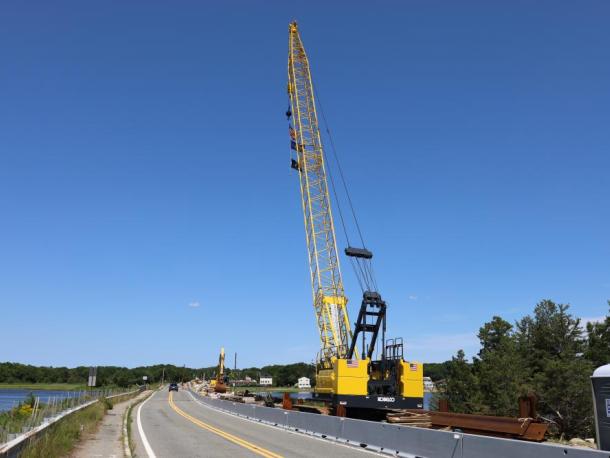Stationary construction vehicles sit at the Route 6 bridge construction site. Photo by Nick Mossman