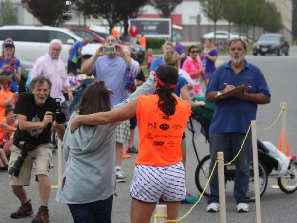 Racers cross the finish line during the 2017 Lazy Lobster road race. File photo