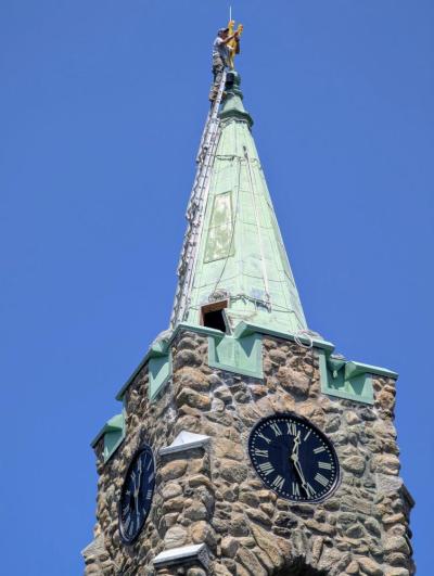 A ladder extends the roof as work is being done. Photo source: Church of the Good Shepherd