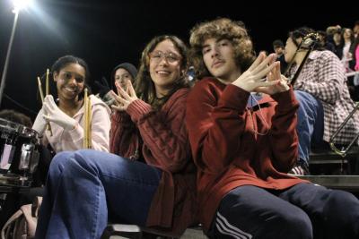 Pep band students between two quarters.