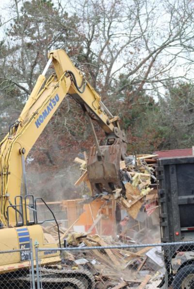 A large dumpster waited for scraps from the building.