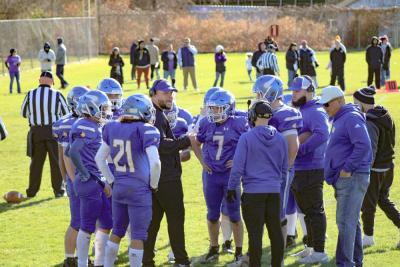 Coach Cy Bariteau pumps up his team during a time-out.
