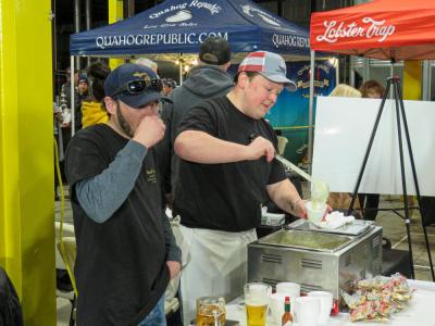 George Stuart, left, and Dan Degan serve of Luna Mezza’s signature chowder to attendees in 2025. File photo