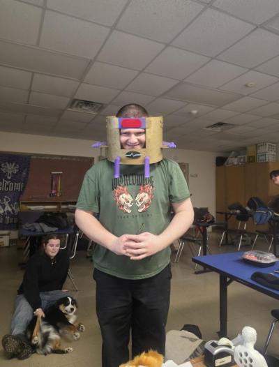 Students test out the Dr. Doom mask made from the tech team. 