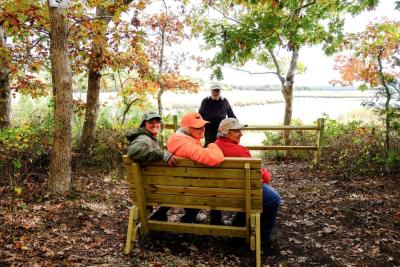 Land Trust members at the bench at Marks Cove Vista. File photo