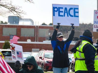 One protestor simply asks for peace. 