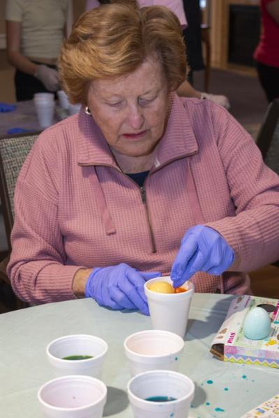 One resident dyes eggs.