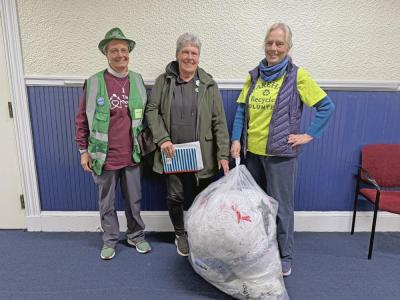 Hilary Greene, Jo-Ann Finn and Amanda Cobb with the collected bag of plastics. 