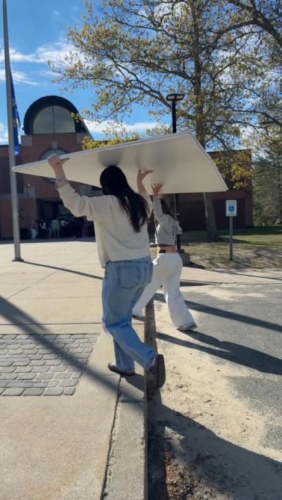 Students carrying in the backing, donated by ScreenMobile SouthCoast.