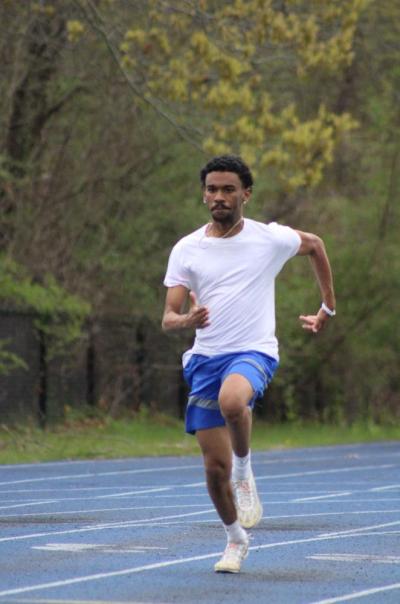 Caleb Carter dashes on the track. Photos by Brandy Muz