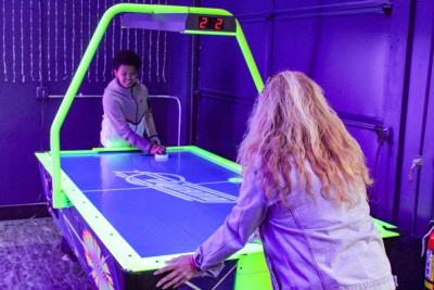 LJ Burdette and Terisa Bumpus dueling in air hockey.