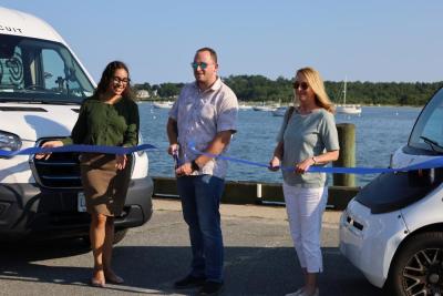 From left to right: Thandi Nyambose, John Faherty and Sarah Corbitt cut the ribbon on the Circuit shuttle. Photos by Nick Mossman