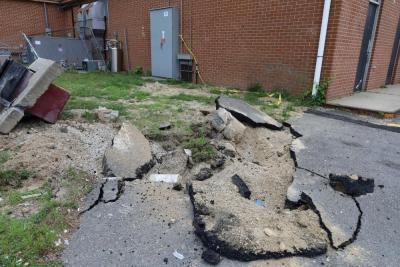 The pavement was battered at the store.
