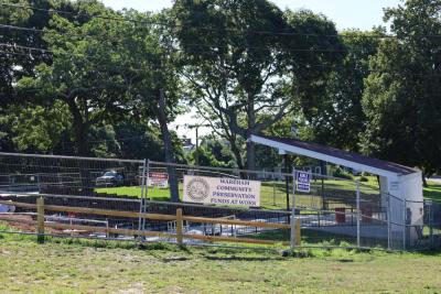 Barriers at the Onset Bandshell at 8:45 a.m. on Wednesday, Aug. 5, which are expected to be taken town later in the day. Photo by Nick Mossman