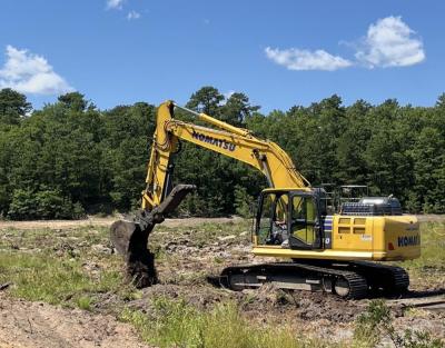 Excavators dig up and mix the soil. Photo by Christian Uva