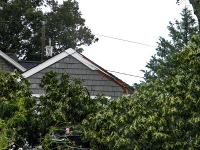 An edge of the garage roof was sliced open, but much of the garage remained unharmed.
