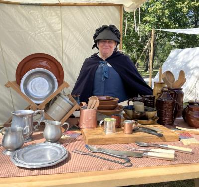 Lesley Pyron, part of the Rehoboth Militia, mans a booth in traditional clothing. “I love to dress up. We all make our own clothes mostly, so I find that entertaining for myself,” she said. “It's just an enjoyable hobby. It’s nice to see what people went through to give us the freedom we have.”