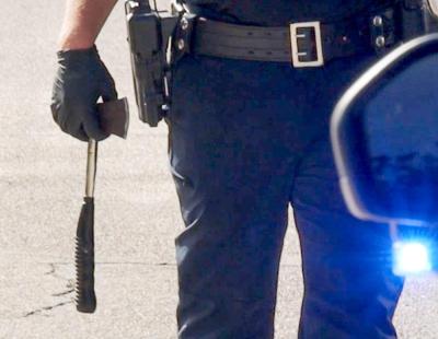 The ax being carried by a police officer. 