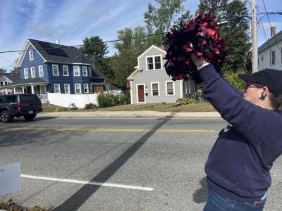 Volunteer Kimmy Schenter cheered cyclists on as they passed through Wareham. 