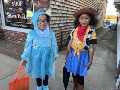 Victoria Perry, 7, and Harmony Lina-Howard, 8, show off their costumes. 