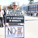Many like David carried two signs.
