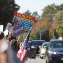 Cars drive by honking in support.