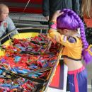 Rumi from Kpop Demon Hunters gets candy from a stretcher at the fire department.