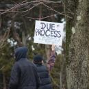 Sean McMills waves to passing cars honking in support. Photos by Brandy Muz