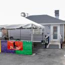 The restaurant is nestled behind Brennan's Smoke Shop.