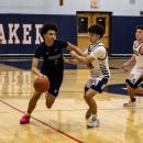 Freshman Cameron Wilson thwarts a steal. Photo by Brandy Muz 