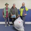 Hilary Greene, Jo-Ann Finn and Amanda Cobb with the collected bag of plastics. Photos by Kat Sheridan