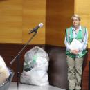 Hilary Greene with her bag of plastic bags, emphasizing over-usage. 