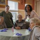 Residents at the table, Rosalie, Patty, Irene and Noreen. Lilly Taylor, Assistant, and Ranie Baptiste, Activities Coordinator. Photos by  Gerrelle Baldwin