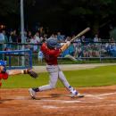 Returner Caden McDonald hits a ball to left field.