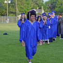 Isis Viera beams as he goes to get his diploma. 